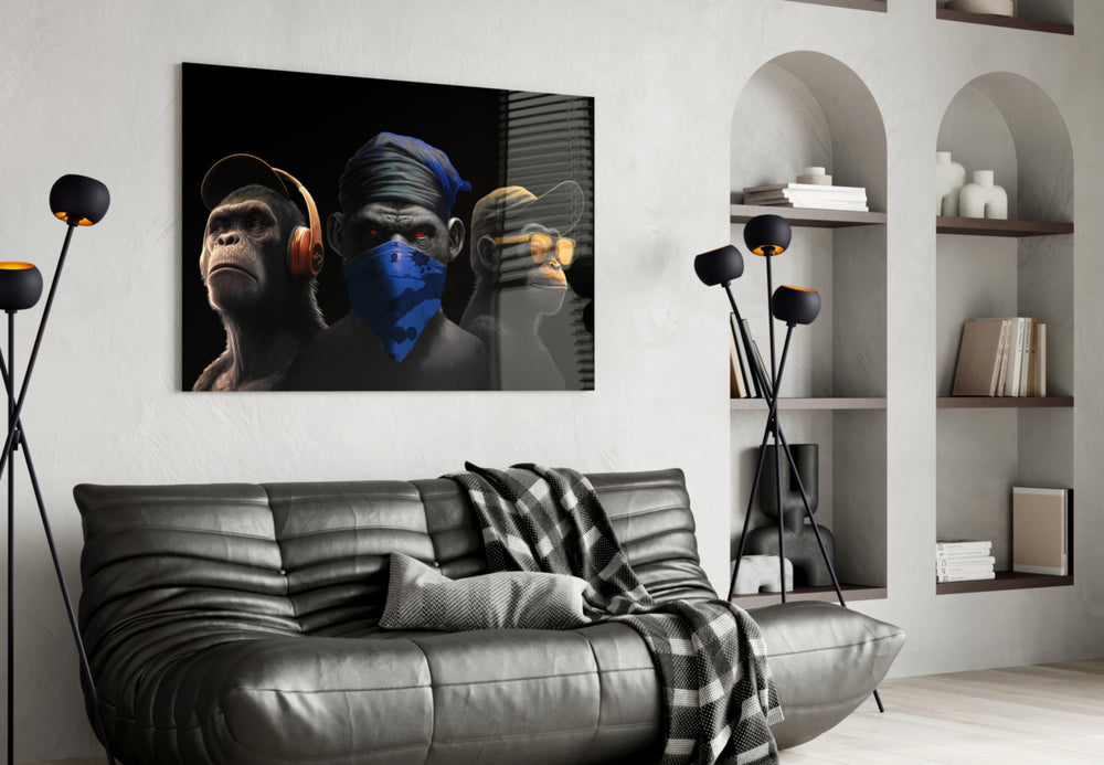 3 Wise Monkeys glass wall art styled above a console in a study