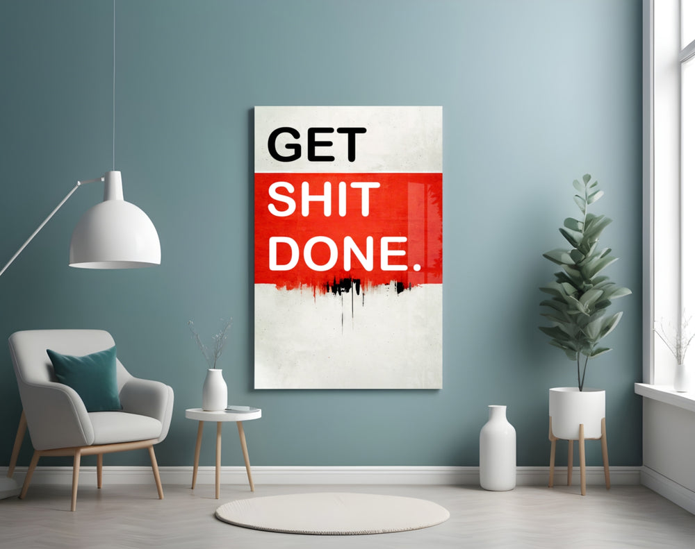 Get Shit Done glass wall art styled above a console in a startup lounge