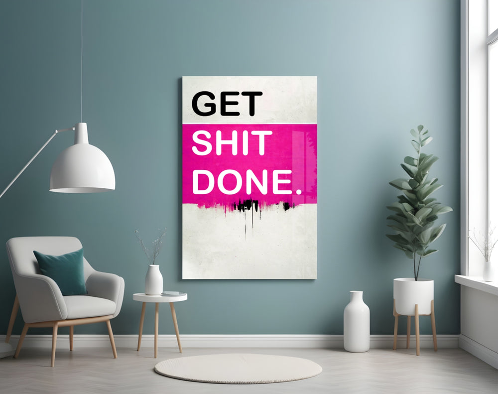 Get Shit Done glass wall art styled above a console in a startup lounge