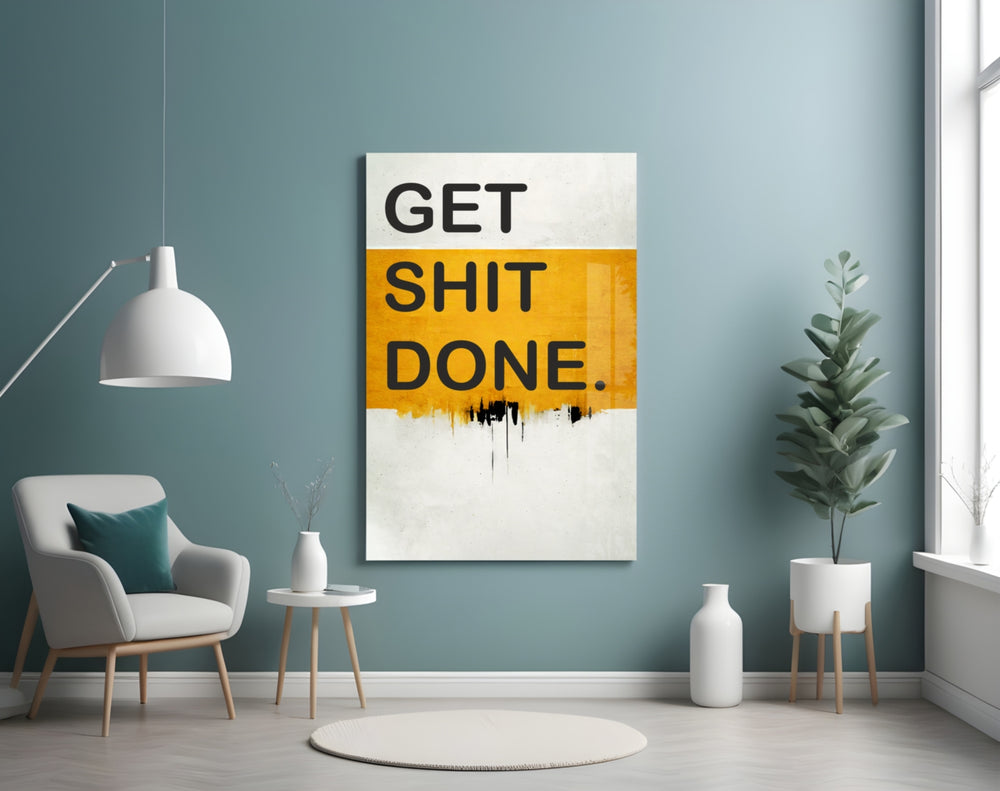 Get Shit Done glass wall art styled above a console in a creative studio