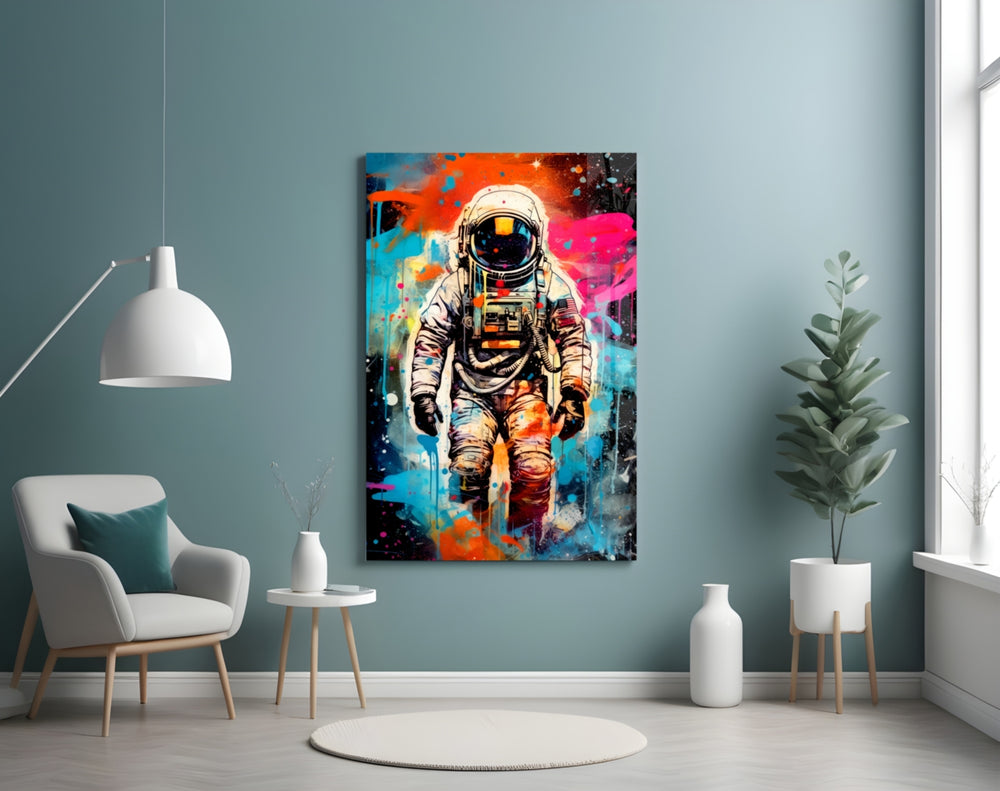 Astronaut glass wall art styled above a sideboard in a creative office