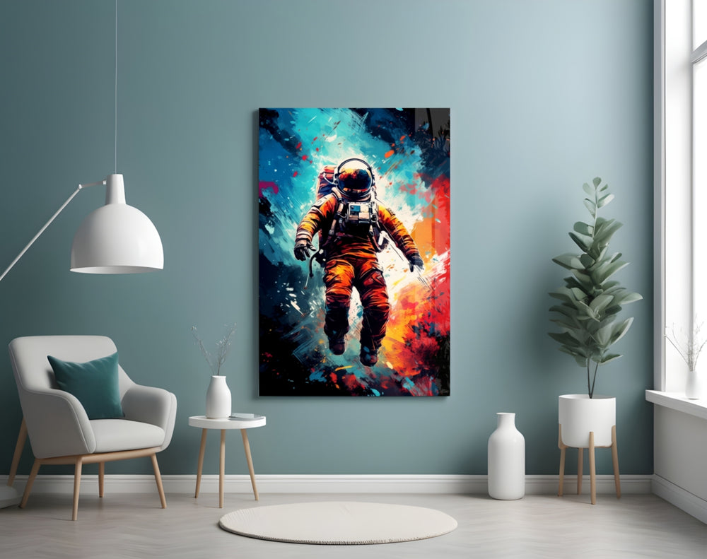 Astronaut glass wall art styled above a sideboard in a creative office