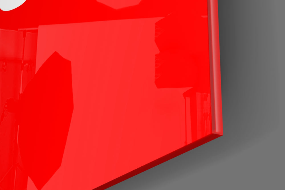Typography artwork anchoring a wall with scarlet-field palette