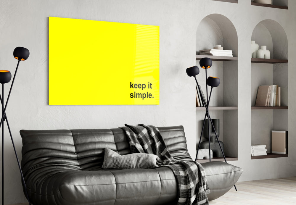 Simple glass wall art styled above a sideboard in a sunroom