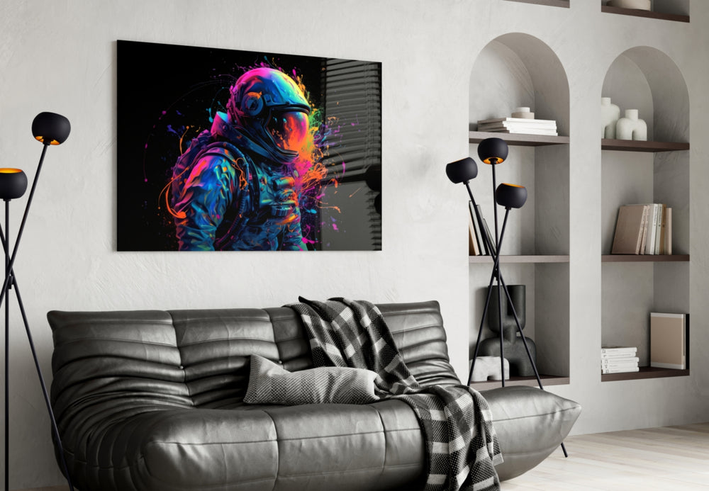 Astronaut glass wall art styled above a sideboard in a creative office
