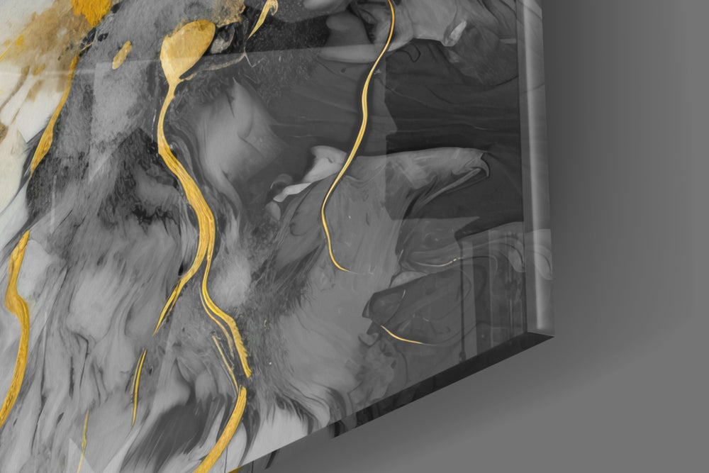 Abstract artwork anchoring a wall with charcoal-and-gold palette