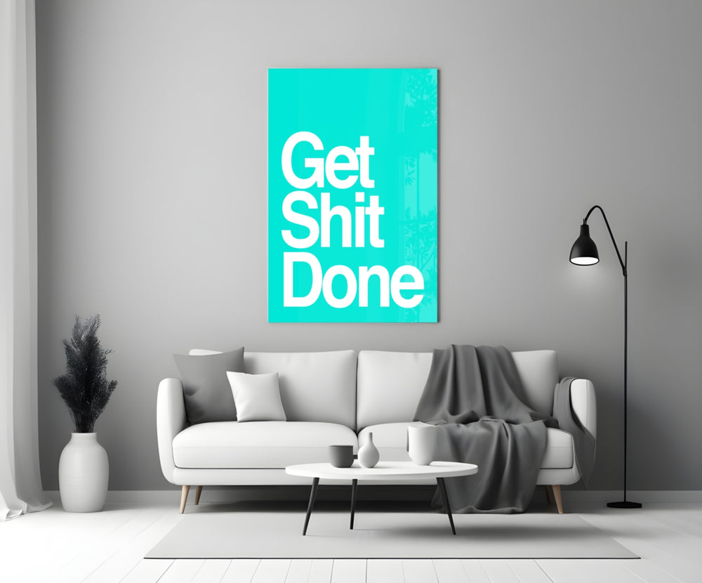 Get Shit Done glass wall art styled above a console in a study