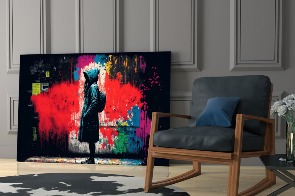 Hooded-protest artwork anchoring a wall with scarlet-and-charcoal palette