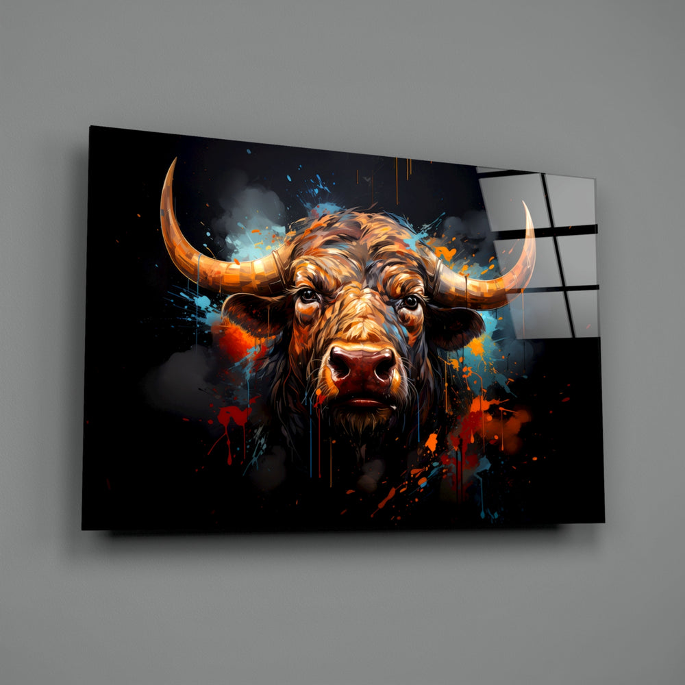 Bull close-up showing golden horns and amber rim-light