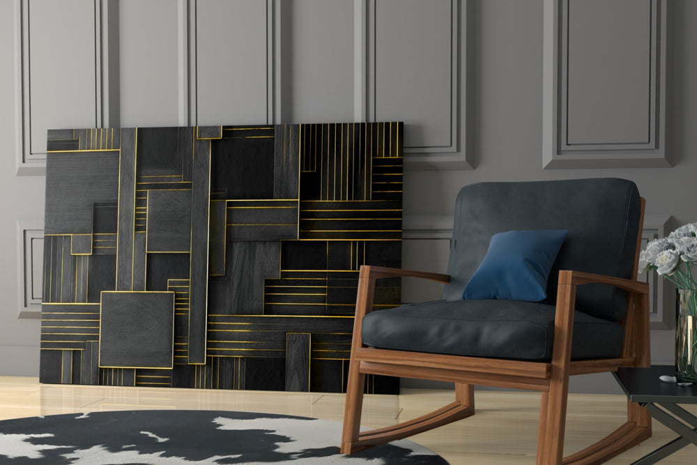 Architectural-geometry artwork anchoring a wall with gold-and-slate palette