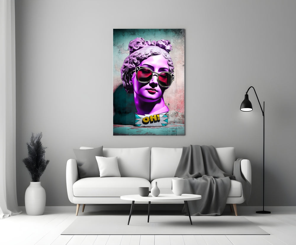Oh glass wall art styled above a console in a living room