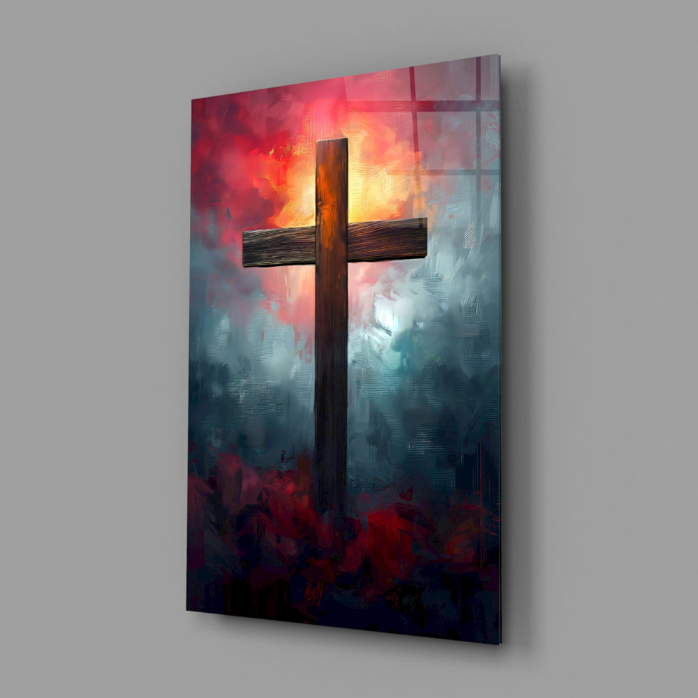 Cross close-up showing silhouette on scarlet-amber sky