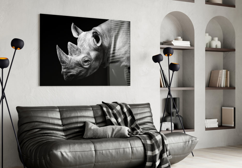 Rhino glass wall art styled above a sofa in a sentinel-mood living room