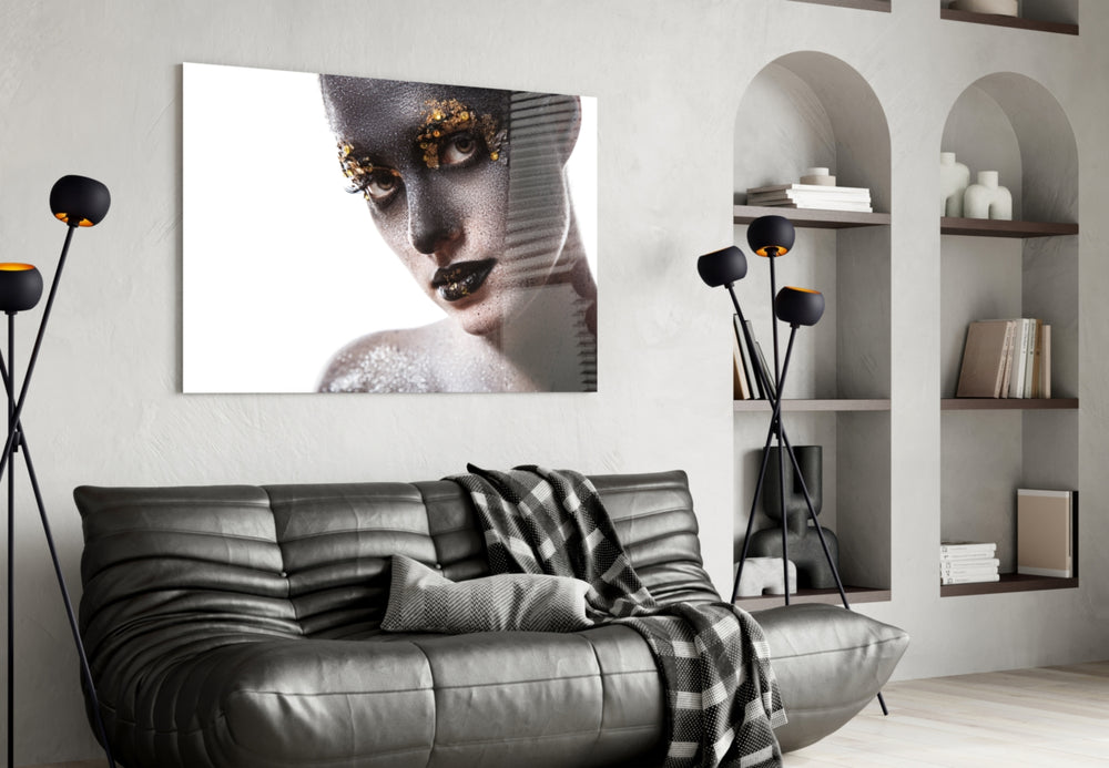 Female Portrait 34 glass wall art styled above a bed in a metallic-accent bedroom