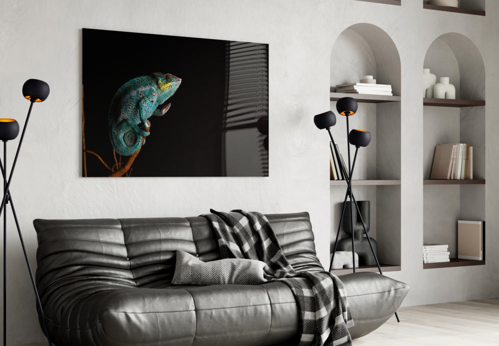 Chameleon glass wall art styled above a desk in an explorer-taste study