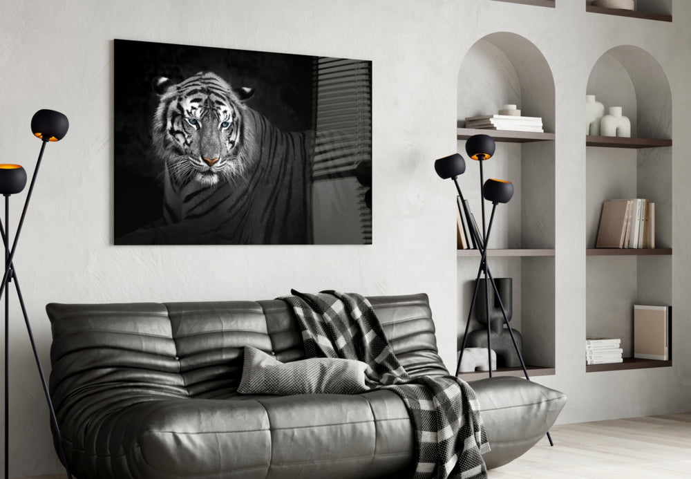 Tiger glass wall art styled above a sofa in a statement living room
