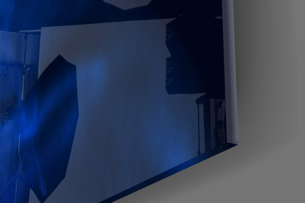 Smoke and Woman artwork anchoring a gallery-inspired wall in monochrome blue