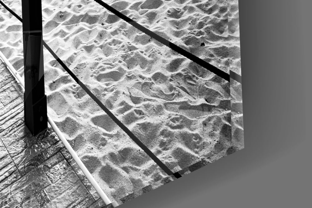 Dock artwork anchoring a coastal-themed wall in monochrome palette