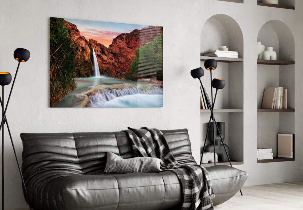Waterfall glass wall art styled above a sofa in an adventure-themed living room