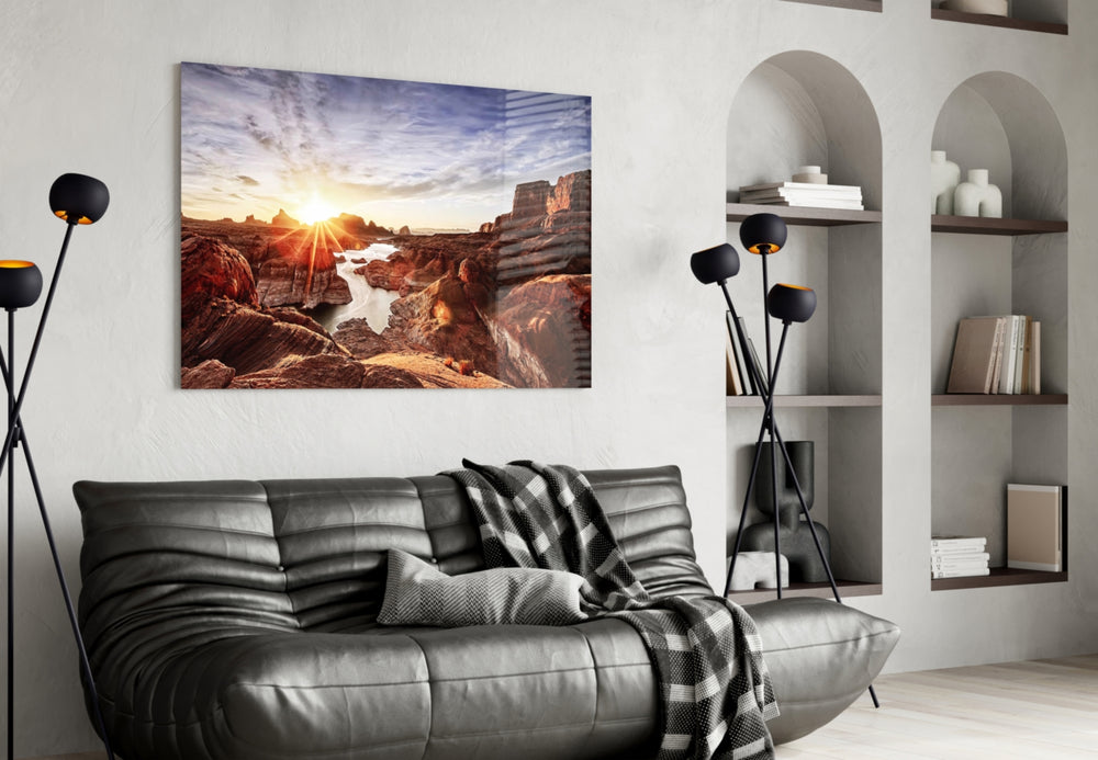 Canyon and Sunset glass wall art styled above a sofa in an adventure-themed living room