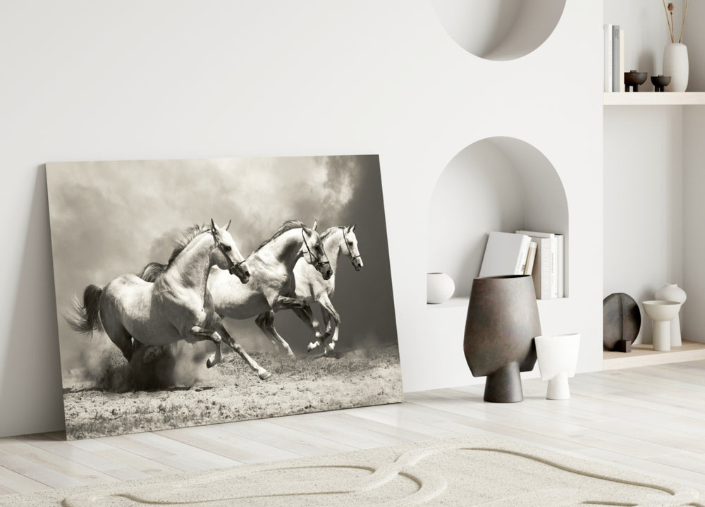 Close-up detail of three white horses thundering through golden dust