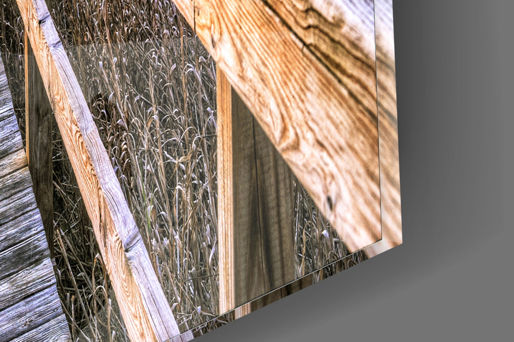 Sunset on the Dock artwork anchoring a coastal-themed wall in warm palette