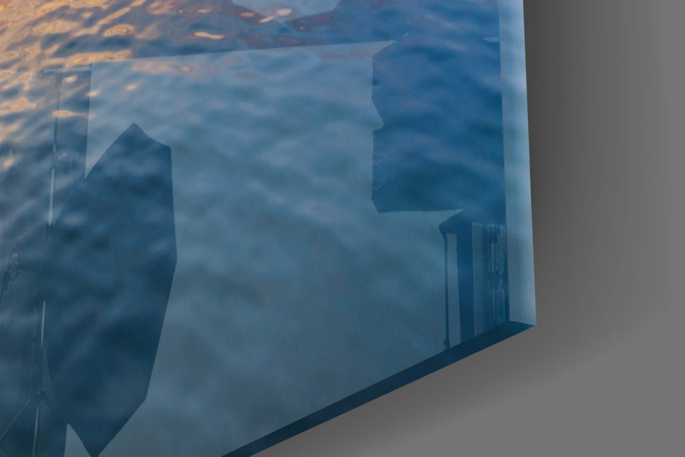 Boat artwork anchoring a coastal-themed wall in warm palette