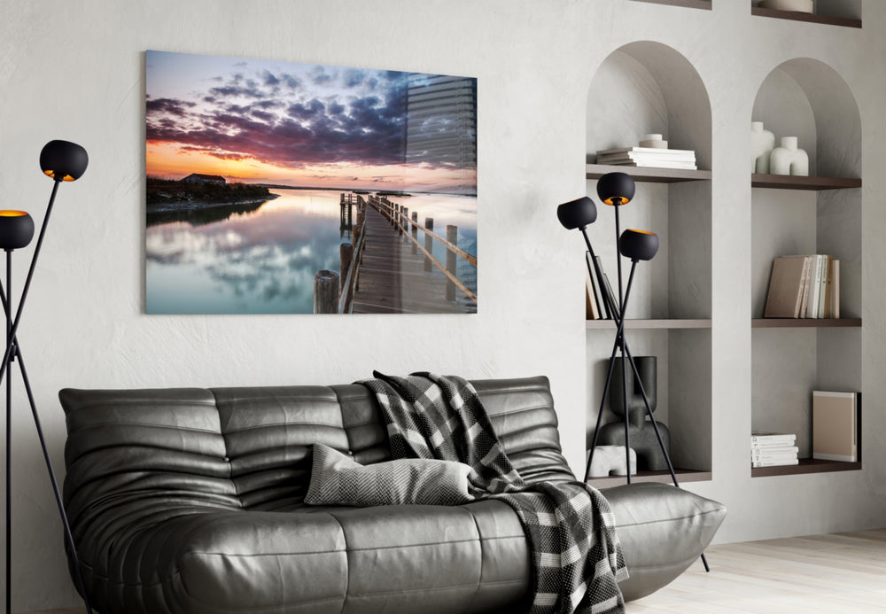 Sunset on the Beach glass wall art styled above a sofa in a cinematic living room