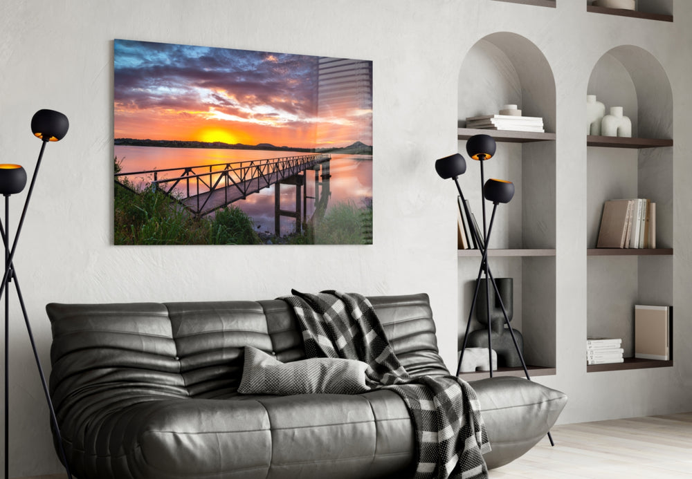 Sunset on the Beach glass wall art styled above a sofa in a cinematic living room