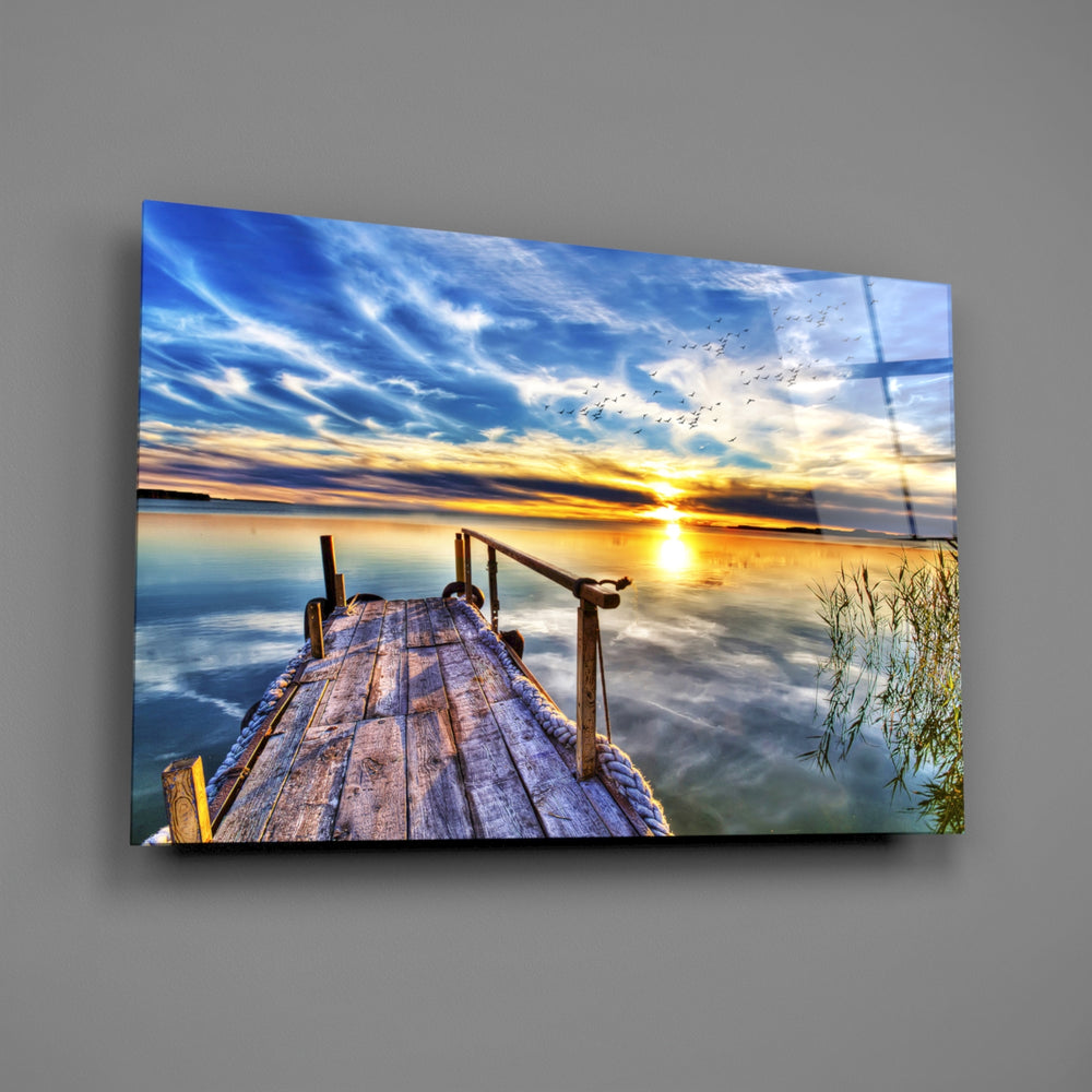 Sunset lake-dock panel bringing horizon focus to a contemporary living space