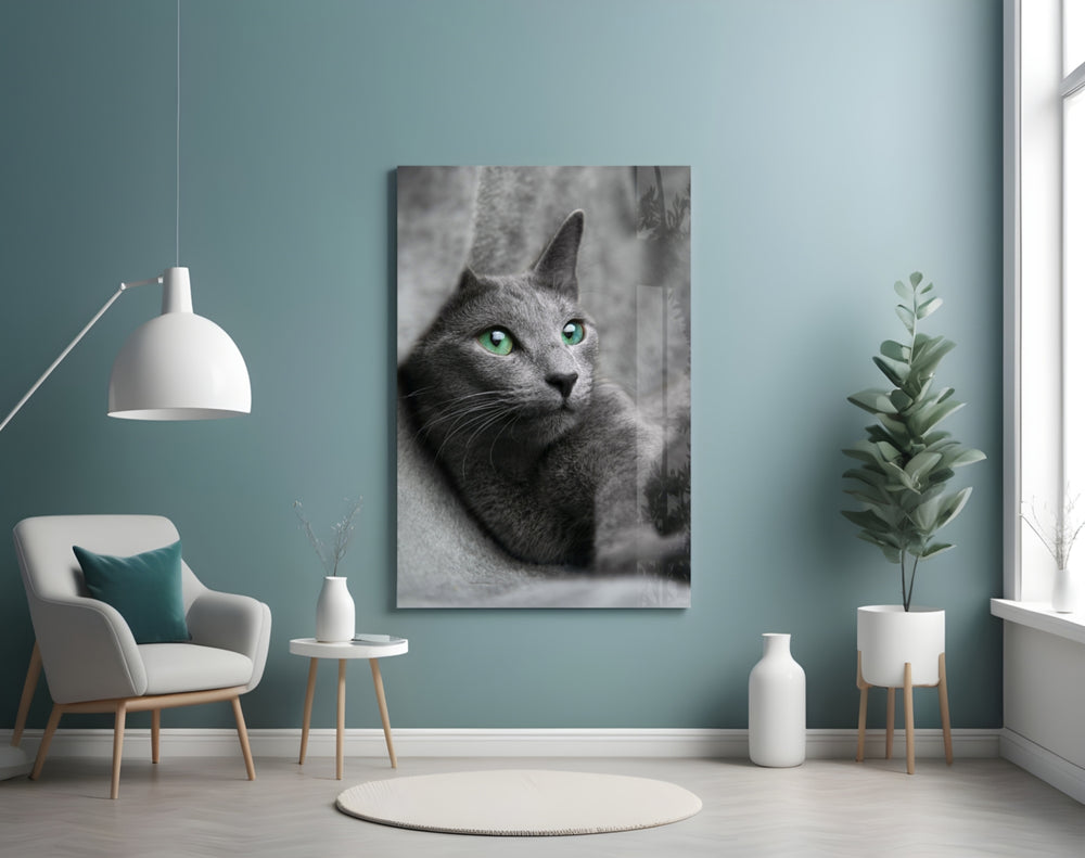 Cat glass wall art styled above a bed in a gentle-palette bedroom