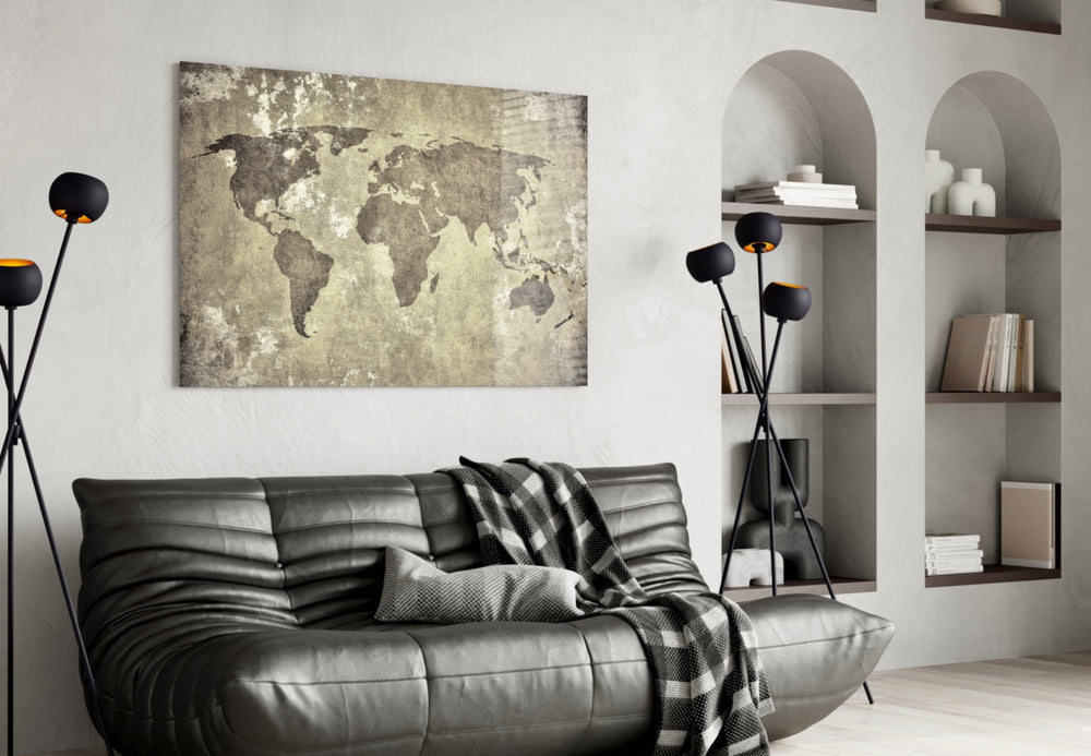 World Map glass wall art styled above a desk in a travel-mood study