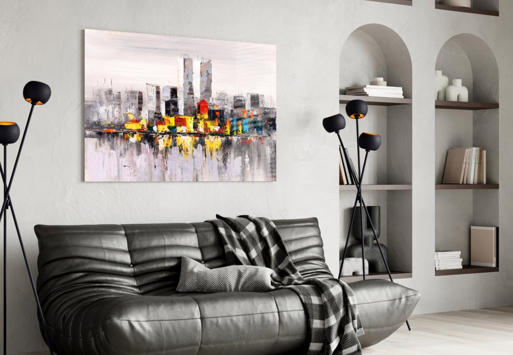 Abstract City glass wall art styled above a sofa in a cosmopolitan living room
