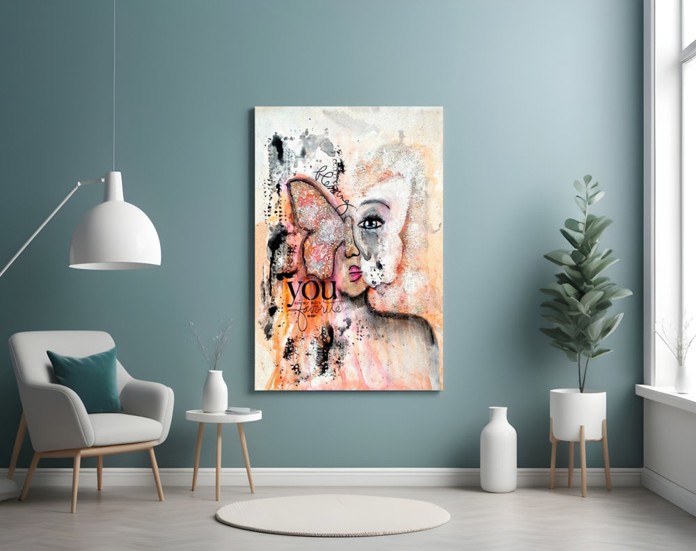 Abstract Woman glass wall art styled above a bed in a gentle-palette bedroom