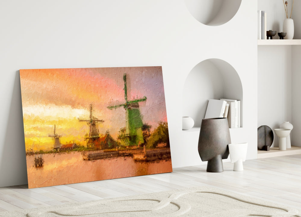 Close-up detail of windmill sails against apricot-and-rose sunset sky