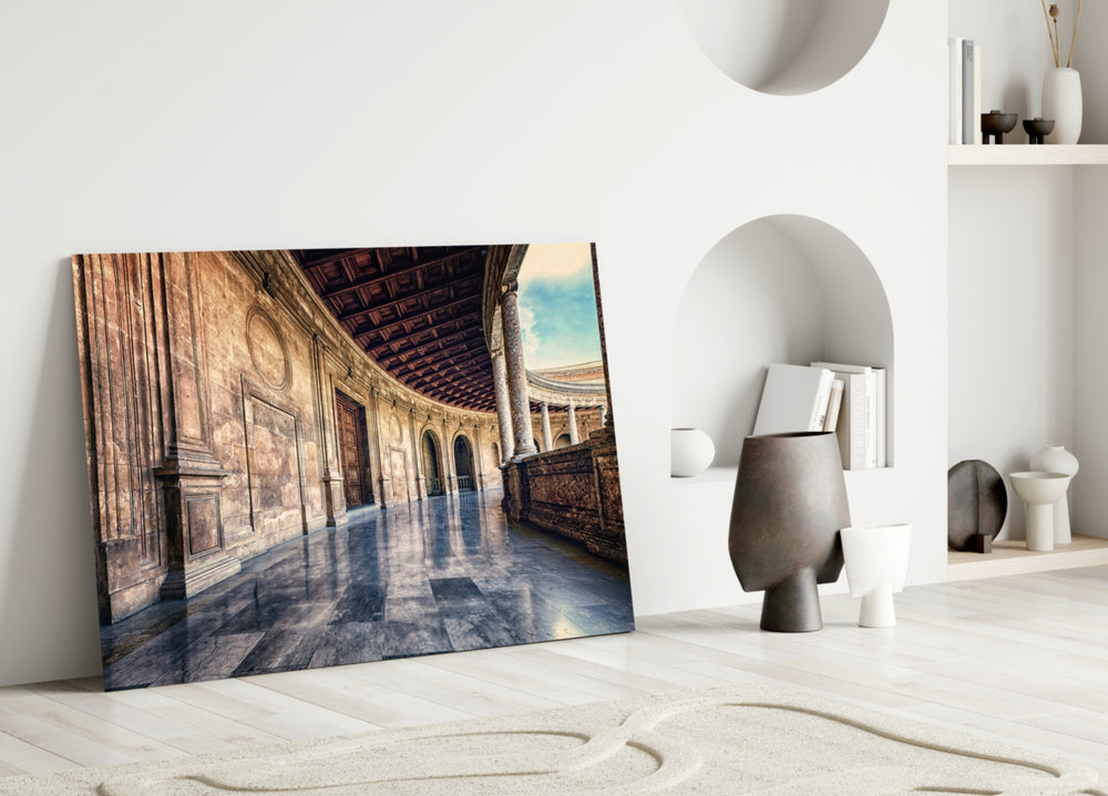 Close-up detail of slim columns and marble reflection under coffered ceiling