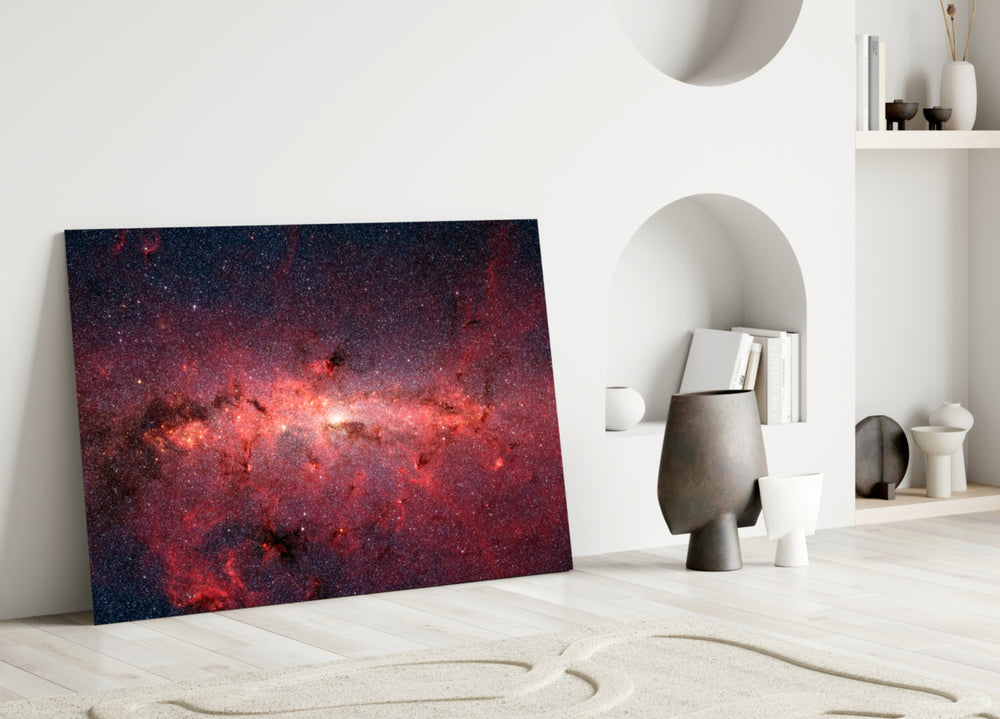 Close-up detail of crimson stardust glowing at the galactic center