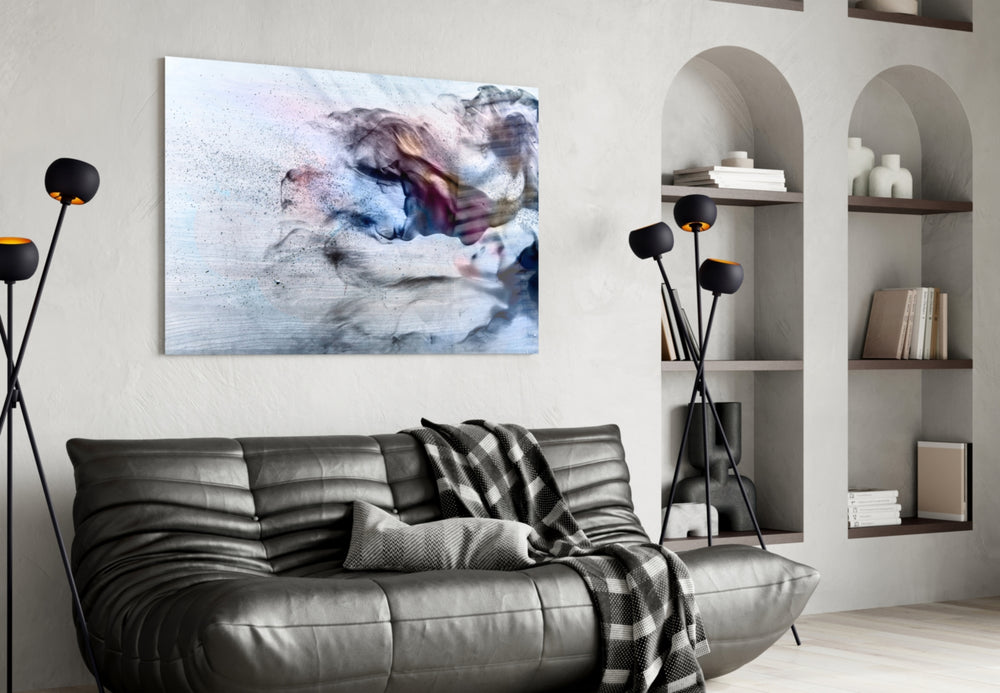 Smoke glass wall art styled above a desk in a reflective study