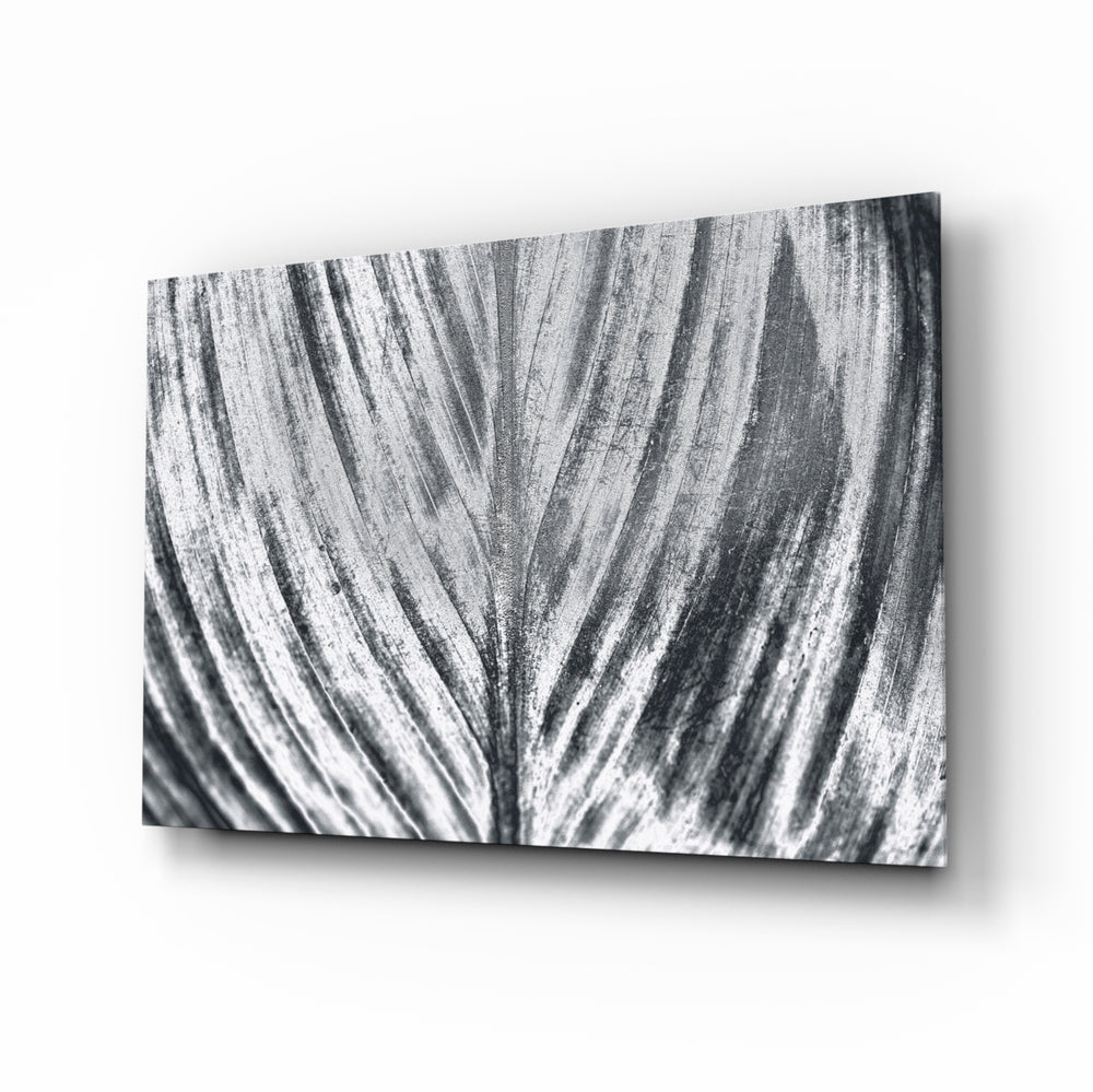 Leaf glass wall art displayed above a console in a designer interior