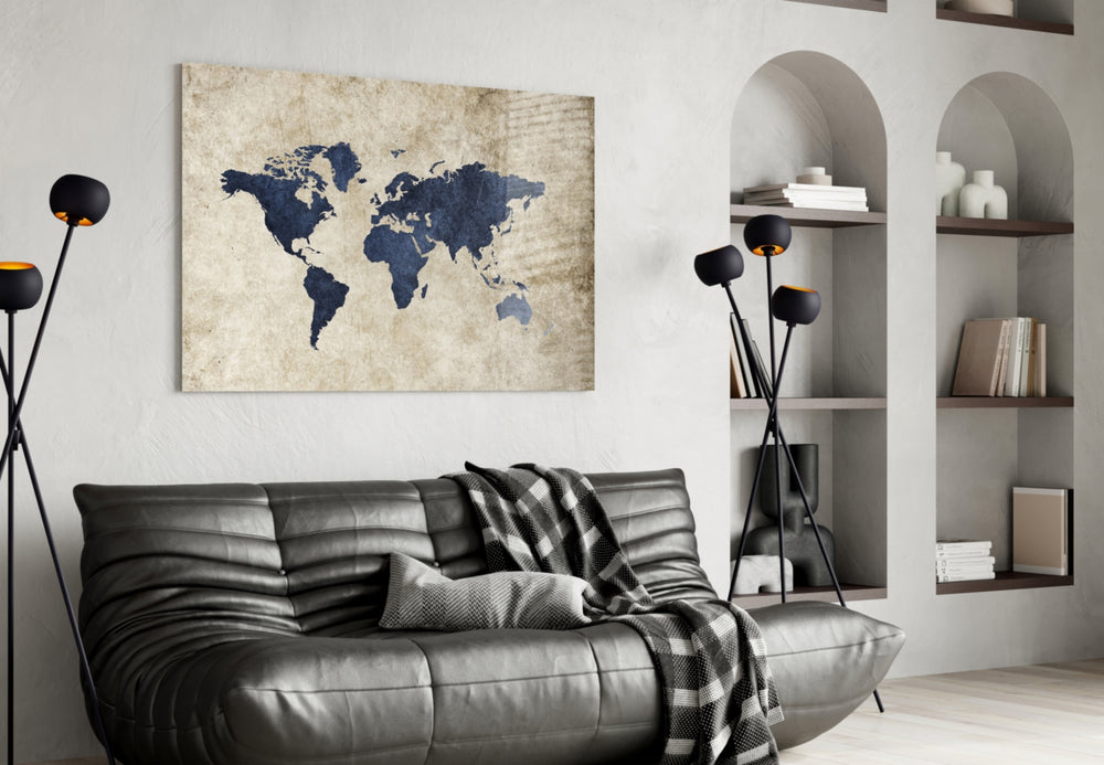 World Map glass wall art styled above a desk in a travel-mood study