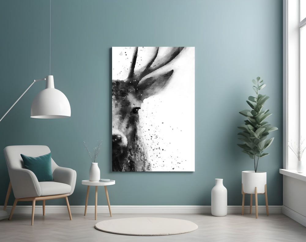 Deer glass wall art styled above a bed in a serene bedroom