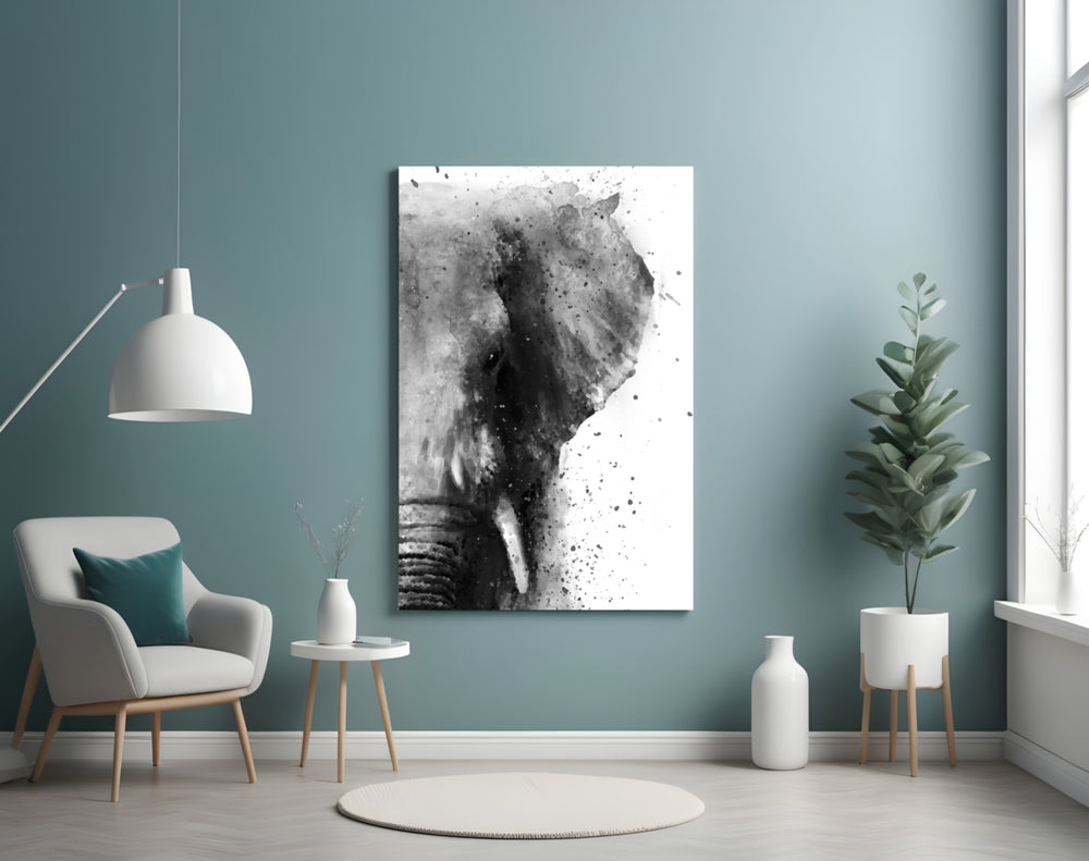 Elephant glass wall art styled above a bed in a nature-forward bedroom