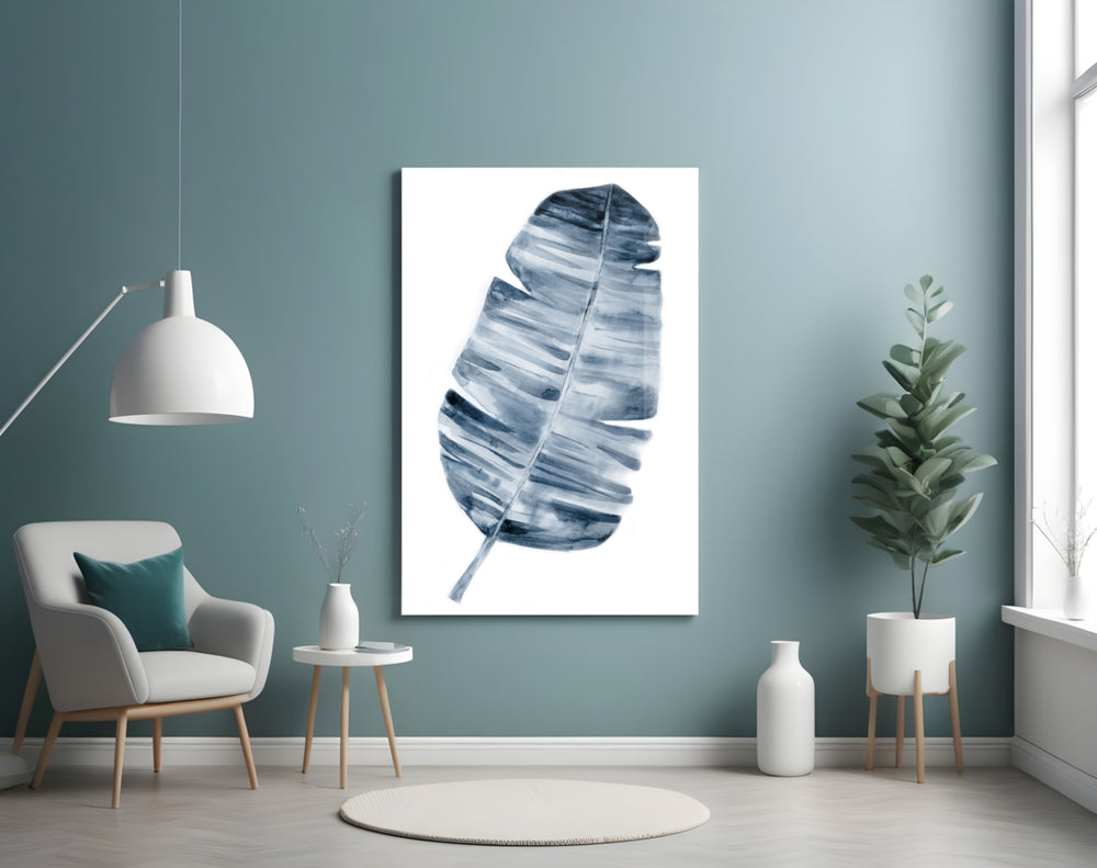 Leaf glass wall art styled above a bed in a coastal-mood bedroom
