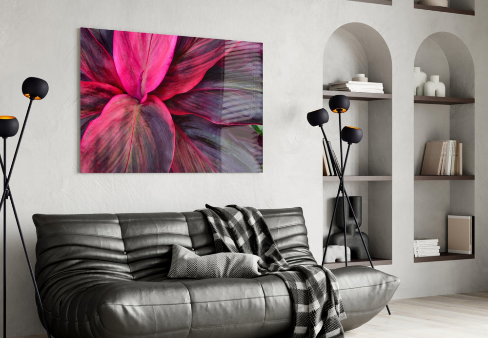 Leaf glass wall art styled above a bed in an intimate bedroom
