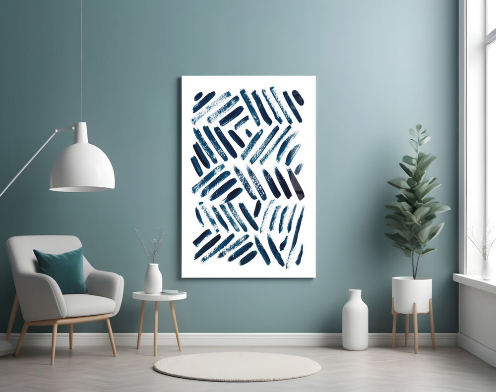 Lines glass wall art styled above a bed in a navy-and-white bedroom