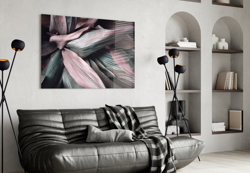 Leaves glass wall art styled above a bed in an intimate bedroom