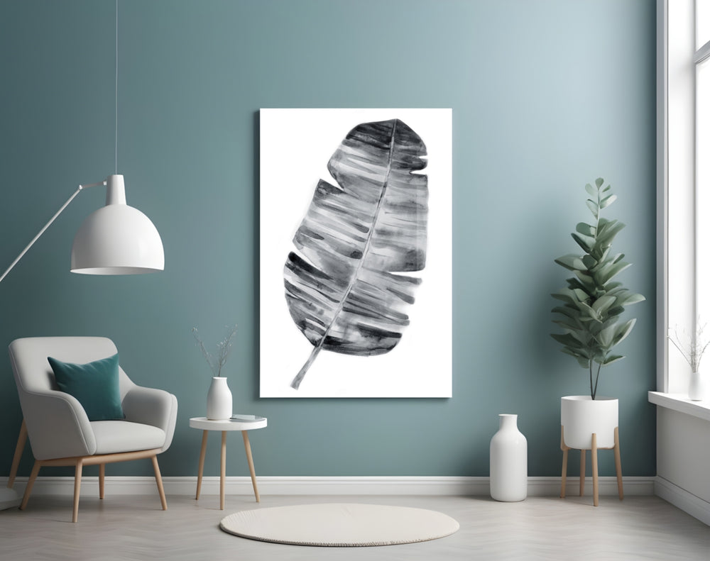 Feather glass wall art styled above a bed in a serene bedroom