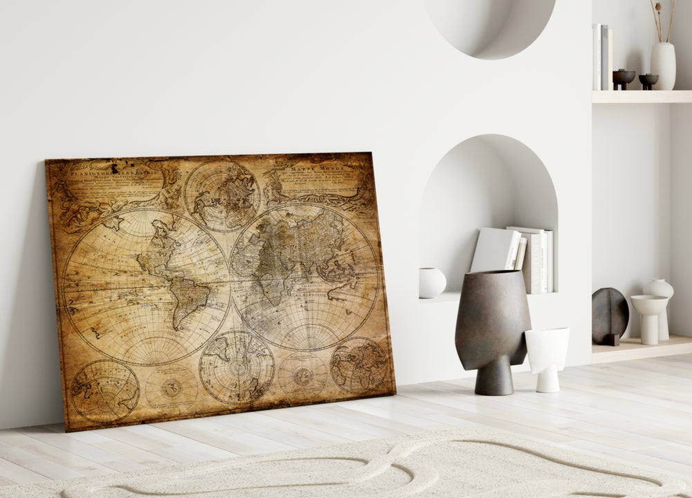 Close-up detail of twin globes on aged sepia parchment
