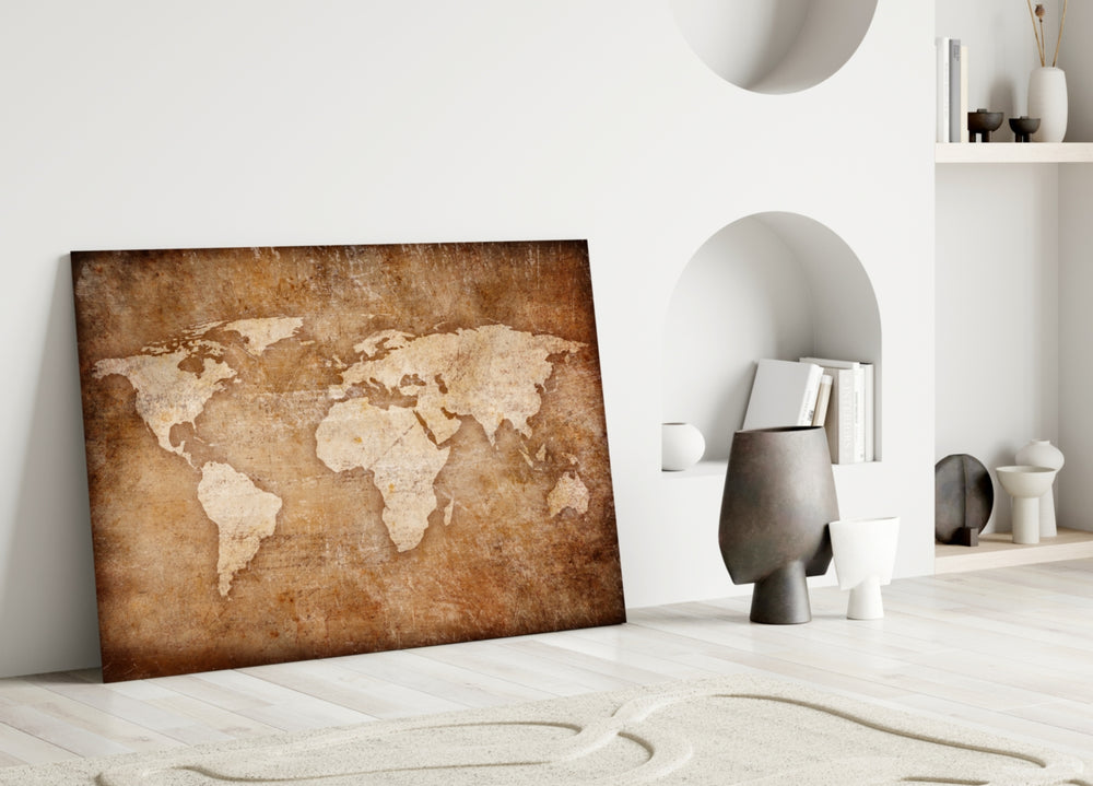 Close-up detail of weathered continents on cocoa-and-amber parchment