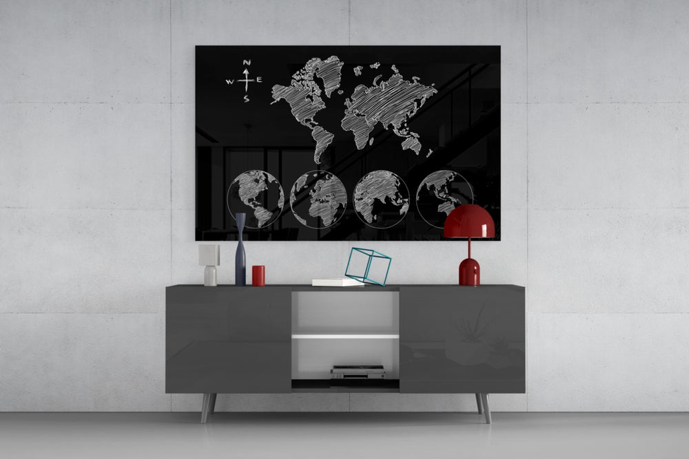 Continents panel catching low light to reveal its sketched globes